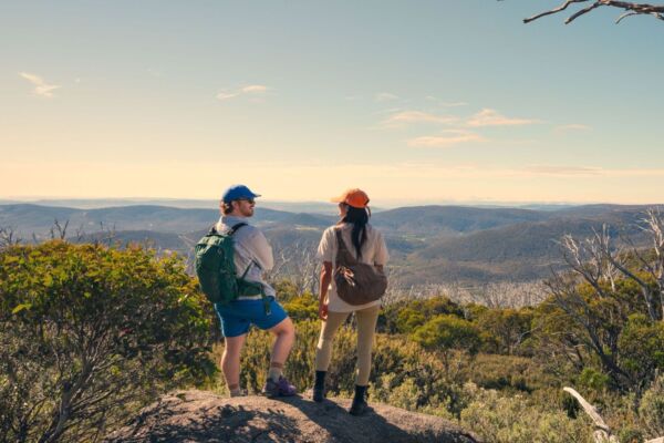 A couple takes in the amazing views during a hike along the Snowies Alpine Walk, - Perisher to Bullocks Flat, Snowy Mountains, Snowy Mountains
